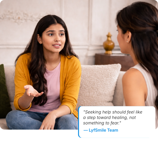 A person sitting thoughtfully by a window